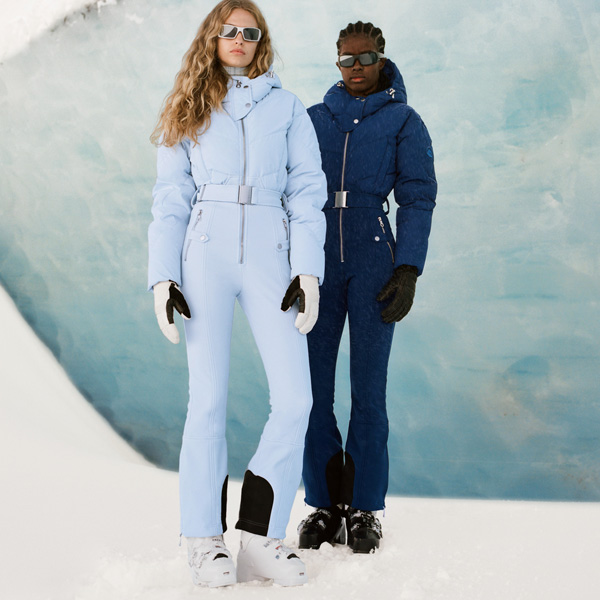 Two women wearing Cordova designer ski suits