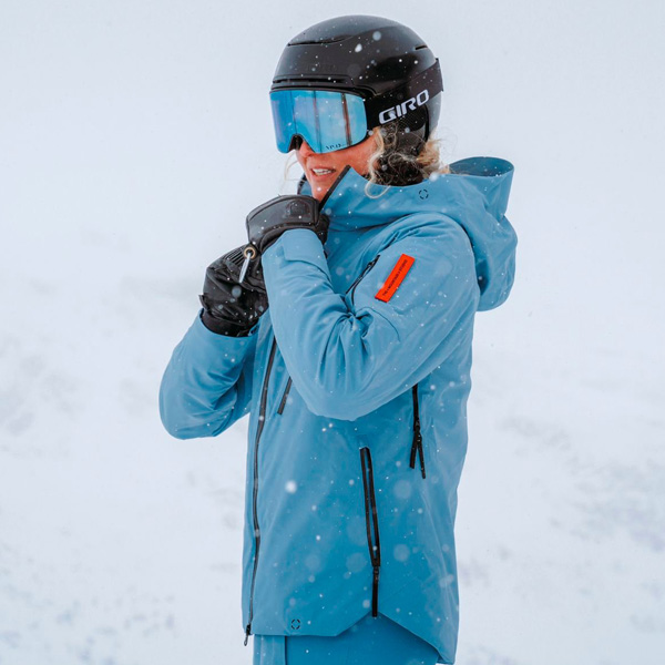 Woman wearing a The Mountain Studio luxury ski jacket